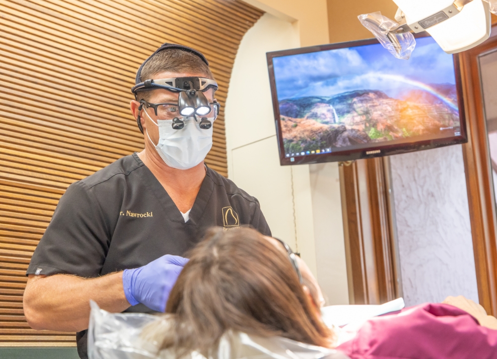 Doctor Nawrocki performing emergency dental exam on a patient