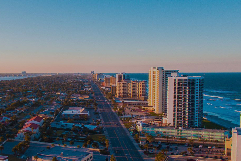 Aerial view of city street next to beach in Ormond Beach Florida