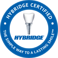 Badge with Hybridge dental implant logo with text that reads Hybridge certified the simple way to a lasting smile