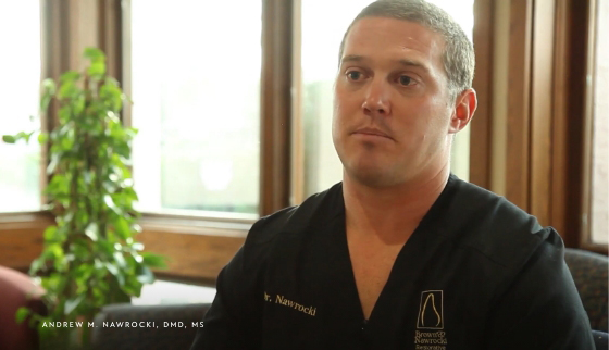 Doctor Nawrocki sitting in armchair in dental office