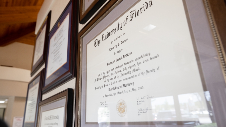 Close up of framed dental degree from the University of Florida for Doctor Kimberly Dennis