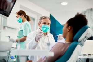 Young patient working with dentist. 