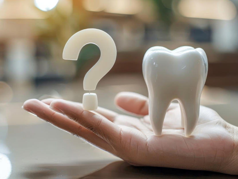3D image of a question mark and a tooth