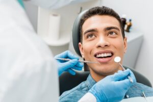 Patient getting dental checkup.